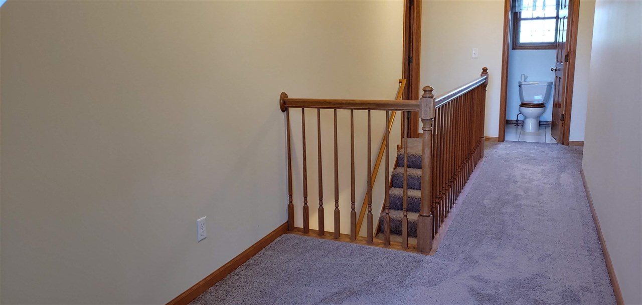 20979 Free Church Road Caledonia, IL 61011 - Photo 25 of 40 a view of a hallway with wooden floor