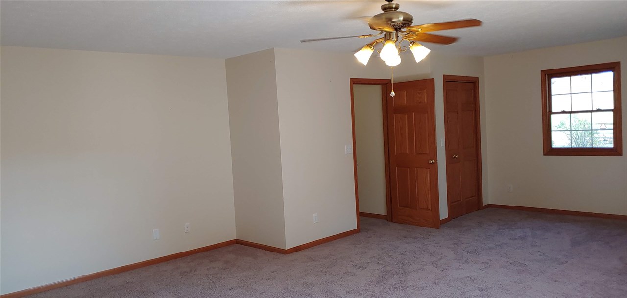 20979 Free Church Road Caledonia, IL 61011 - Photo 31 of 40 a view of a room with a ceiling fan and window