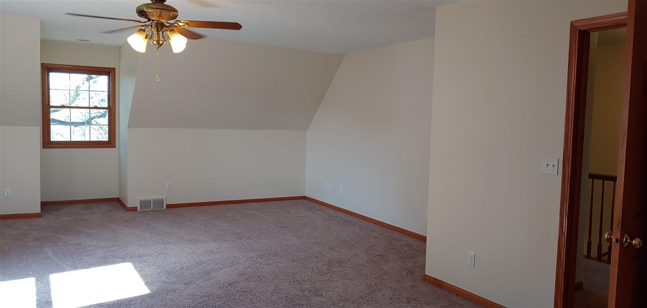 20979 Free Church Road Caledonia, IL 61011 - Photo 32 of 40 an empty room with windows and fan