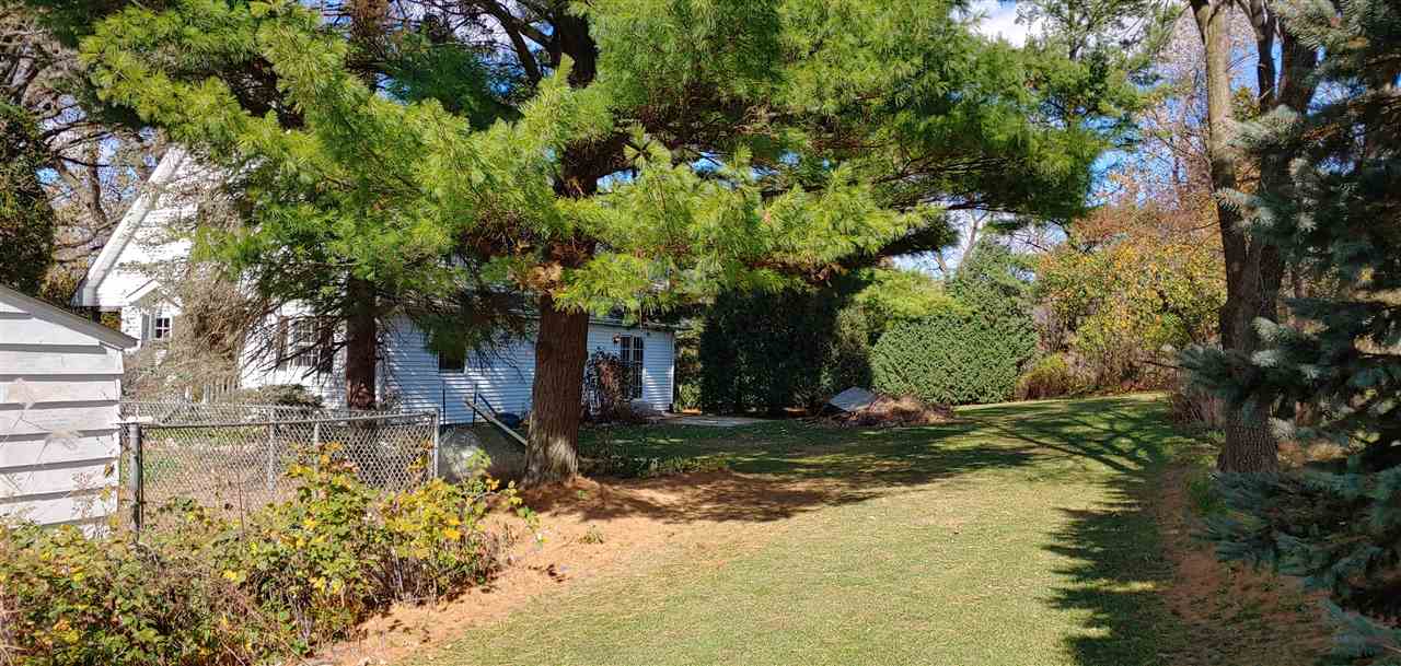 20979 Free Church Road Caledonia, IL 61011 - Photo 8 of 40 a view of a yard with plants and trees