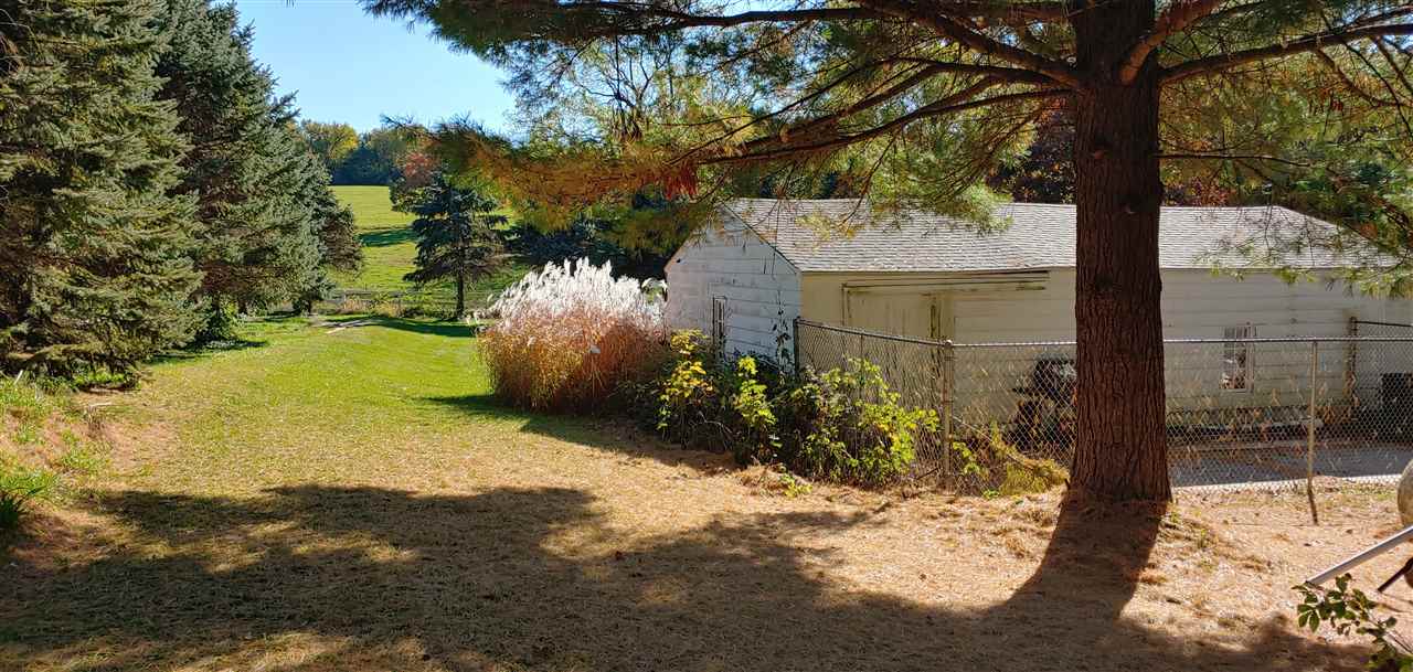 20979 Free Church Road Caledonia, IL 61011 - Photo 10 of 40 a view of a yard with plants and trees