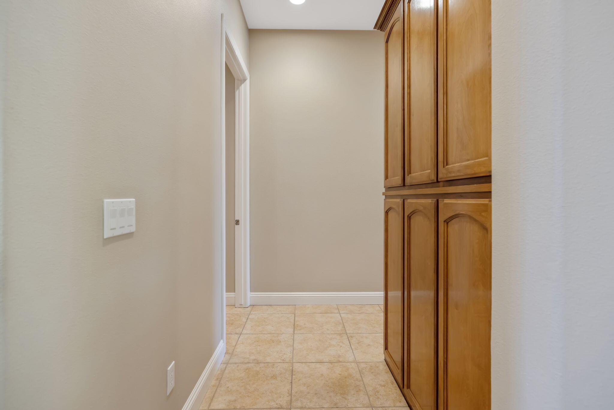 760 St James Court Exeter, CA 93221 - Photo 43 of 77 East hallway entracne (laundry room left, bedrooms right)