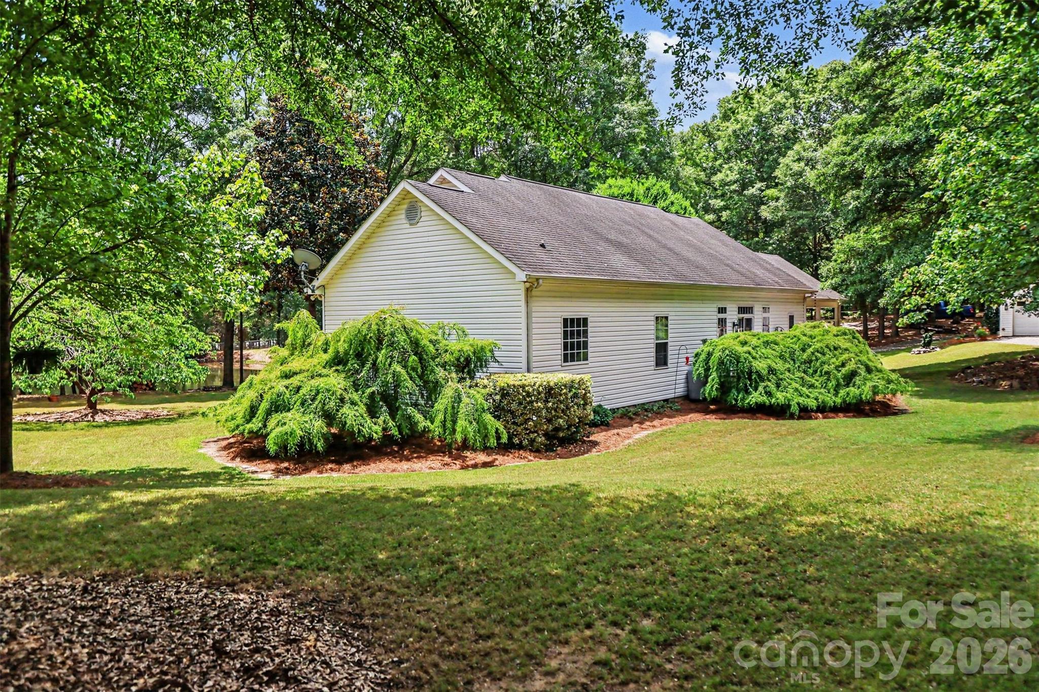 4037 Old Williamston Road Belton, SC 29627 - Photo 26 of 41 a house view with a garden