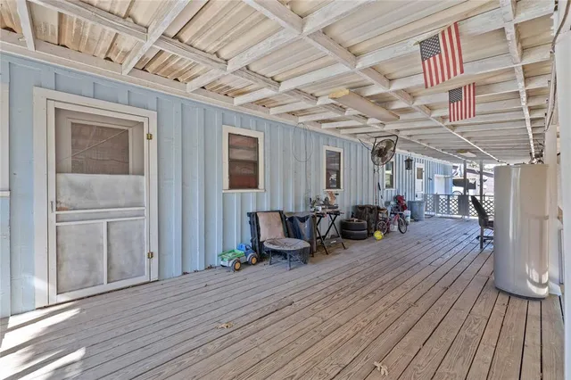 a view of a chairs in wooden deck