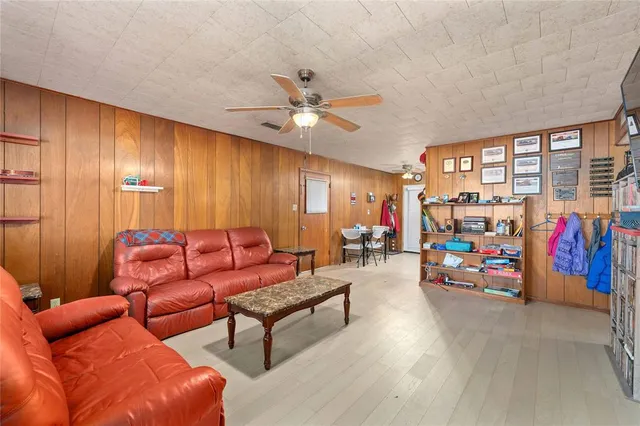 a living room with furniture a couch and a window