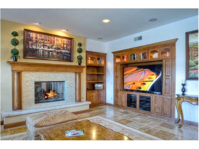 2461 Lapis Road Carlsbad, CA 92009 - Photo 12 of 25 The custom built media cabinetry ties in with tasteful d cor & discretely houses all your AV equipment. Ceiling speakers in Great room and MBR, as well as house speakers in many of the other rooms & backyard.