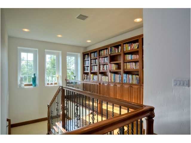 2461 Lapis Road Carlsbad, CA 92009 - Photo 17 of 25 Another built in creates a library and art display at the top of the wrought iron stairway.