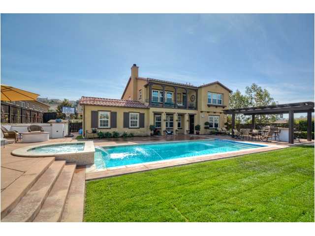 2461 Lapis Road Carlsbad, CA 92009 - Photo 3 of 25 The raised sun terrace featuring a firepit & spa allow family and friends to take in the views, pool & outdoor dining. ** Added bonus is the newly installed "retractable" pool cover that reduces cleaning/chemical bills and increases pool safety.