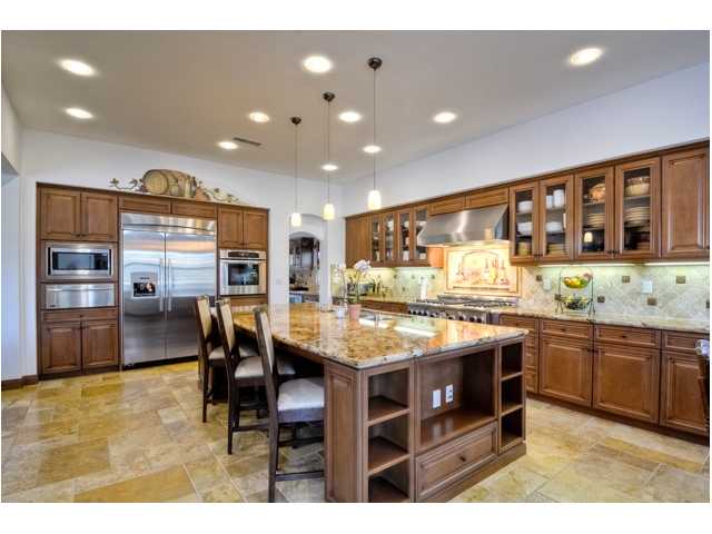 2461 Lapis Road Carlsbad, CA 92009 - Photo 8 of 25 This will definitely be the center of family activity that is anchored by a large full slab granite island. Long spacious counters, extra storage, walk in pantry and coffee bar make entertain small or large gatherings breeze.