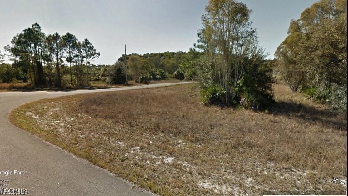 740 Harcourt Avenue Lehigh Acres, FL 33974 - Photo 2 of 7 a view of an outdoor space with deck