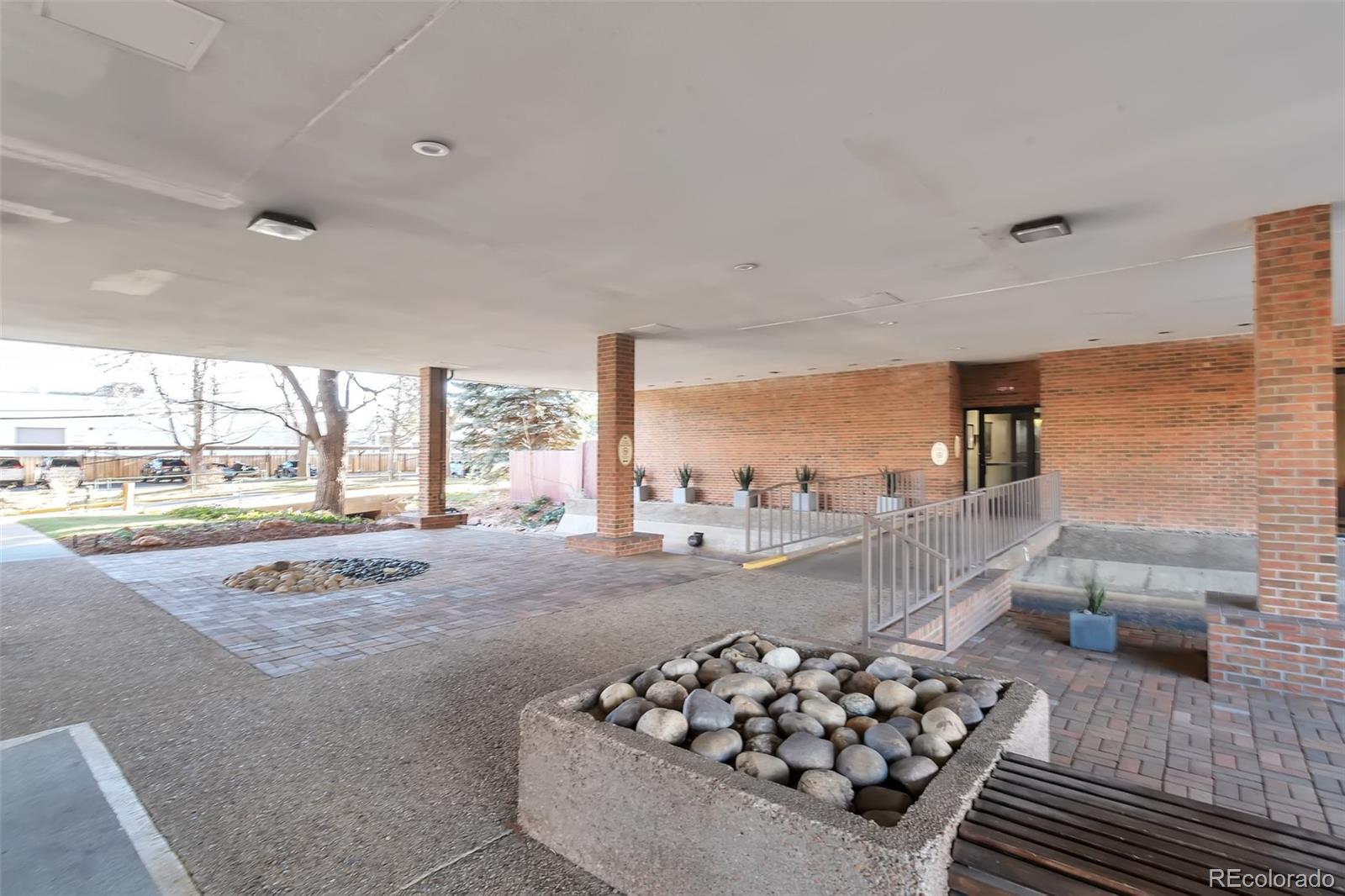 1850 Folsom Street, Unit 411 Boulder, CO 80302 - Photo 26 of 28 a living room with furniture and a floor to ceiling window