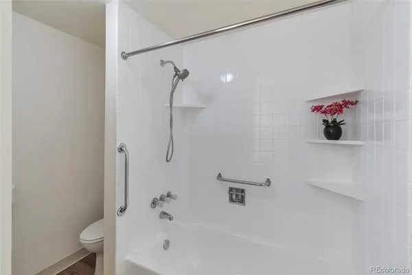 a bathroom with a bathtub and a shower