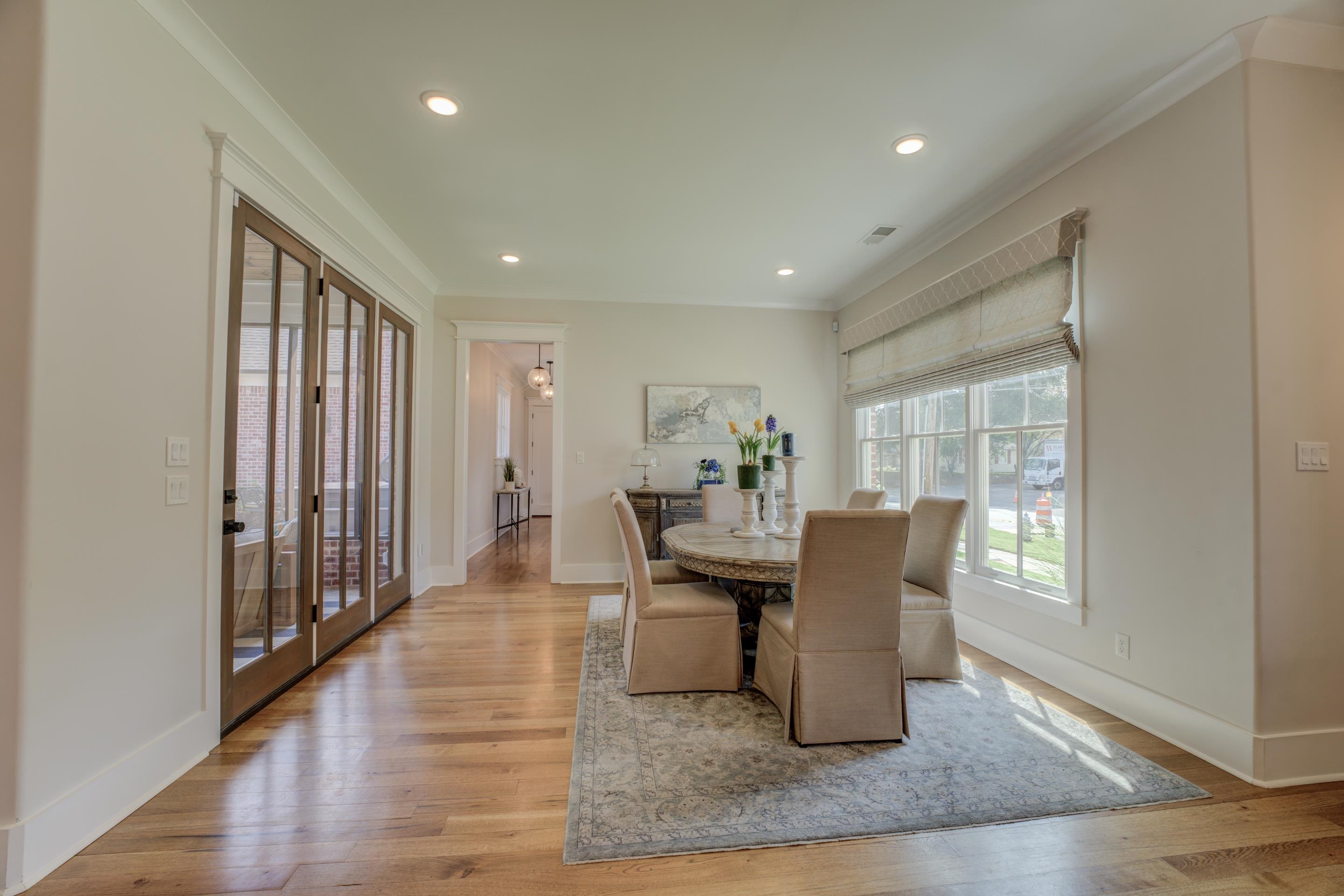 112 North Mt Pleasant Road Collierville, TN 38017 - Photo 15 of 40 a dining room with wooden floor and glass door