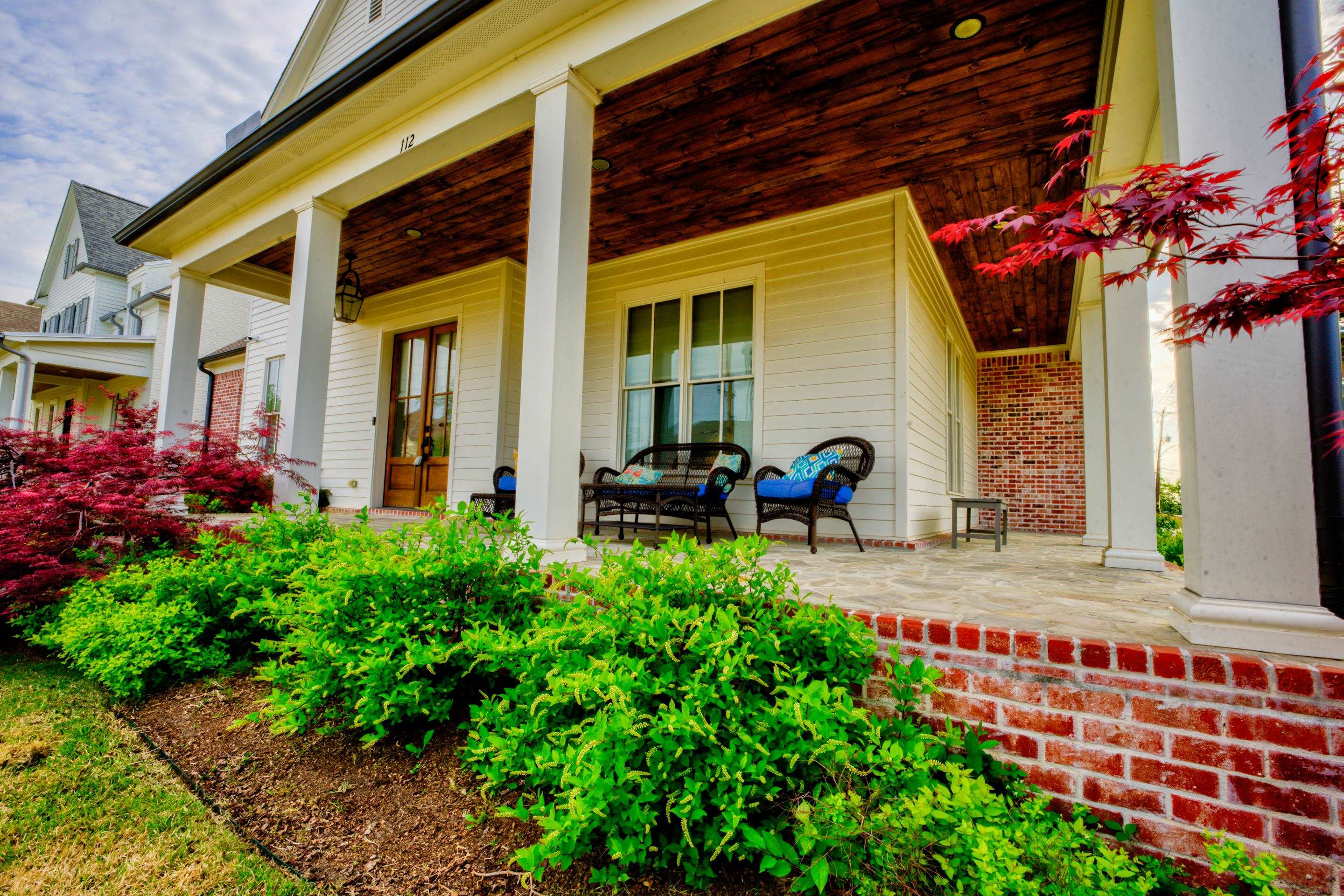 112 North Mt Pleasant Road Collierville, TN 38017 - Photo 2 of 40 a front view of a house with lots of green space
