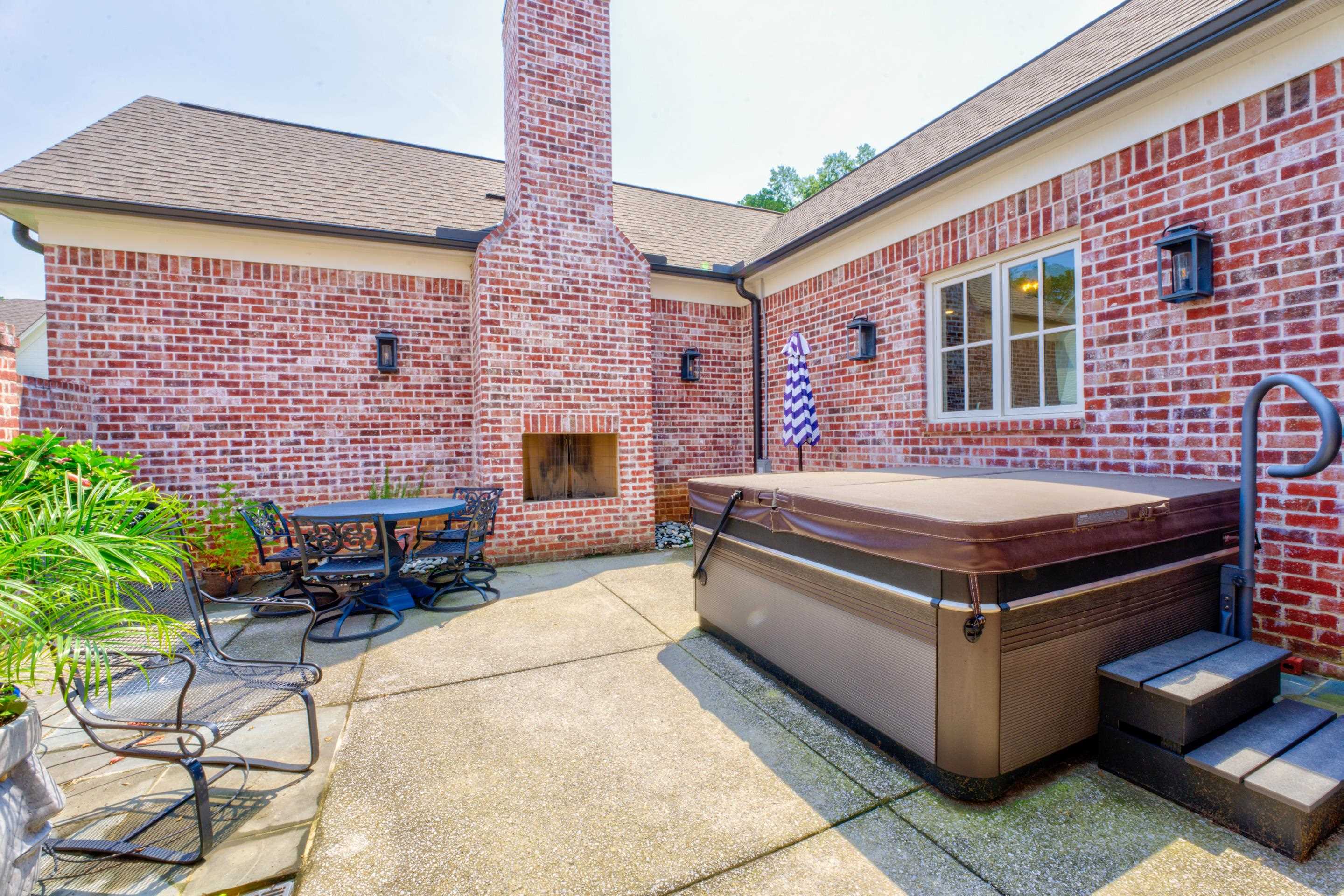 112 North Mt Pleasant Road Collierville, TN 38017 - Photo 36 of 40 a building outdoor space with patio furniture and a potted plant