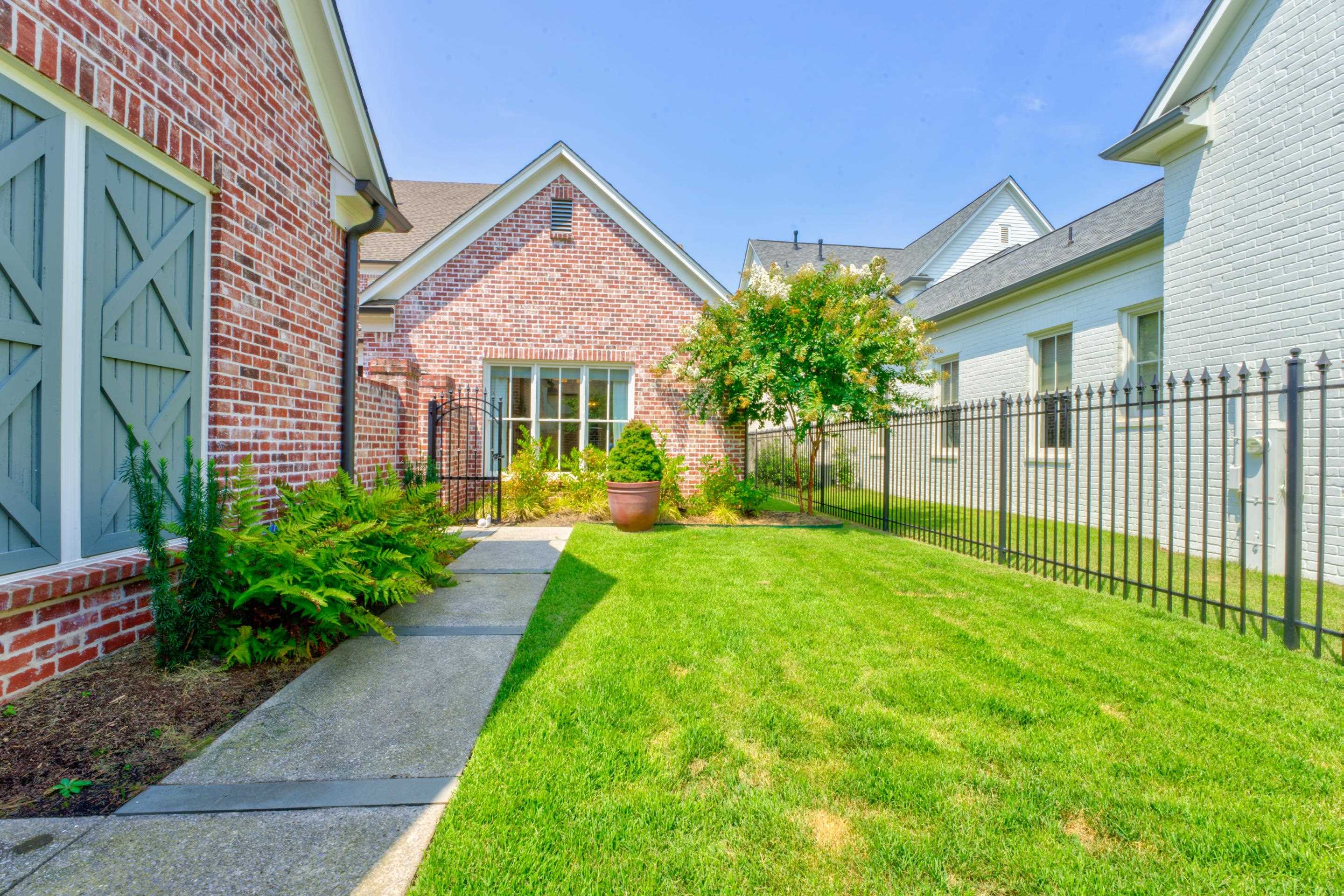 112 North Mt Pleasant Road Collierville, TN 38017 - Photo 37 of 40 a view of an house with backyard and garden