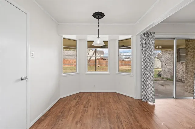 a kitchen with cabinets a sink and white appliances