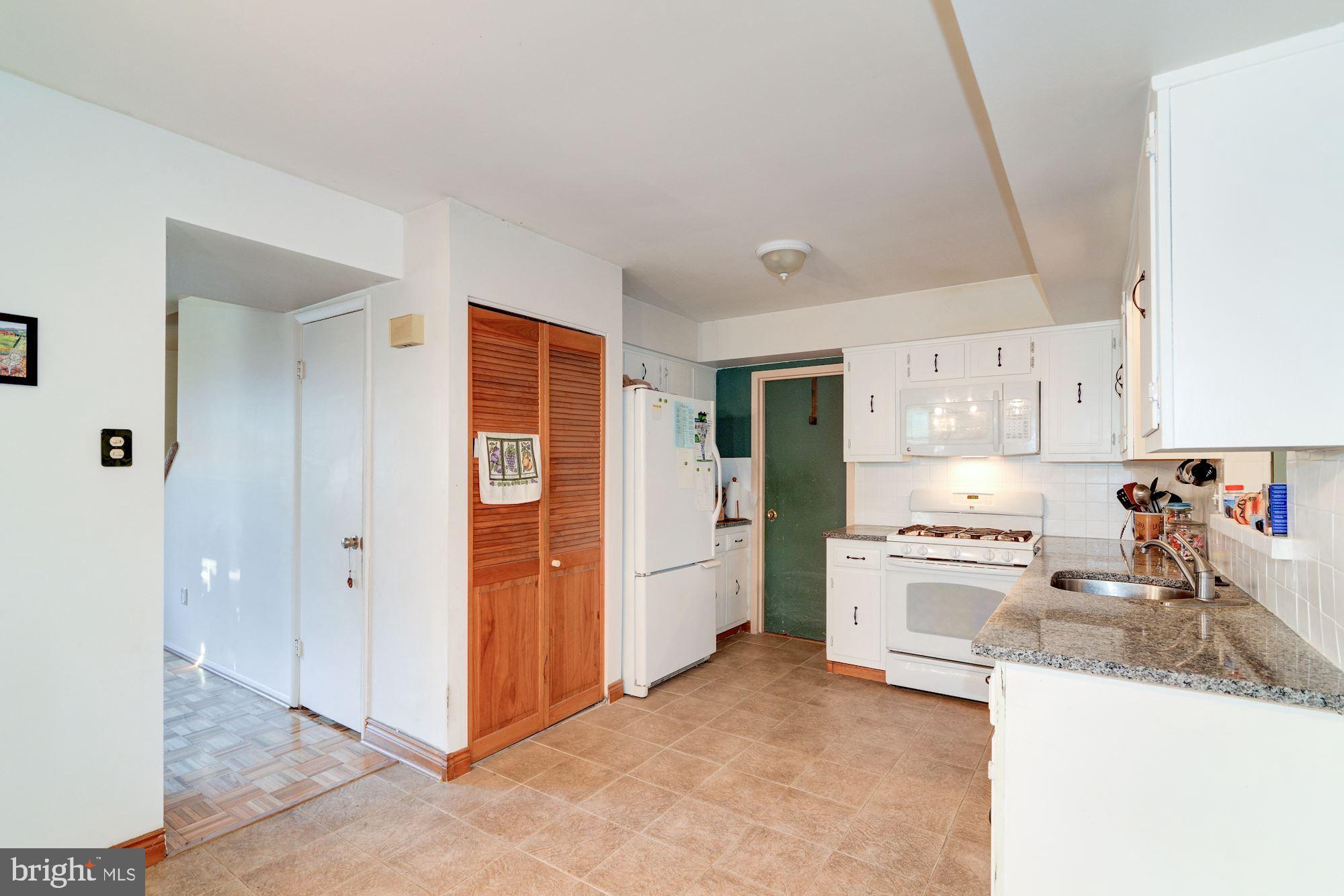 1604 Coventry Place Clementon, NJ 08021 - Photo 14 of 45 a kitchen with stainless steel appliances granite countertop a sink stove and refrigerator