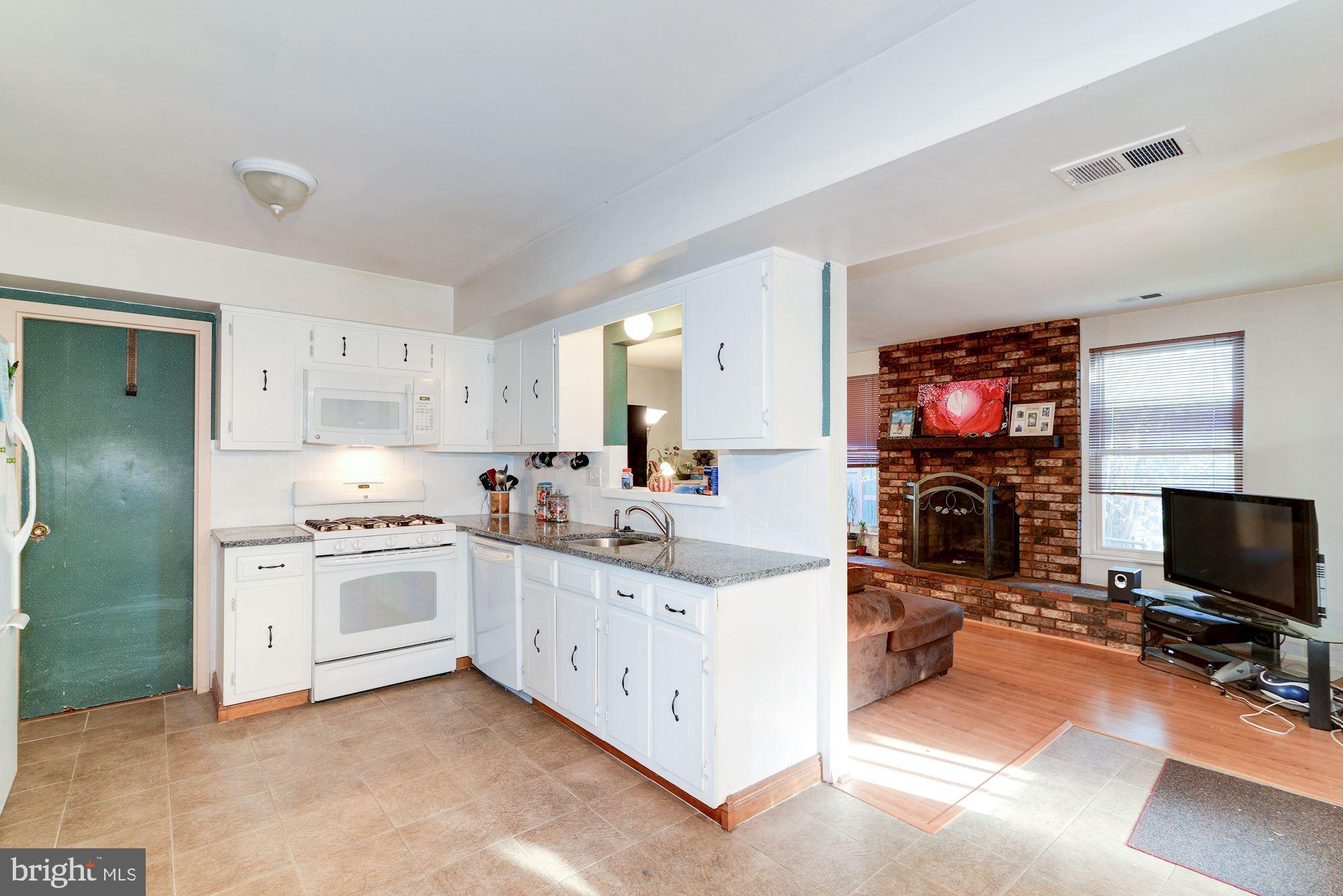 1604 Coventry Place Clementon, NJ 08021 - Photo 16 of 45 a view of a kitchen with kitchen island a sink stainless steel appliances and cabinets