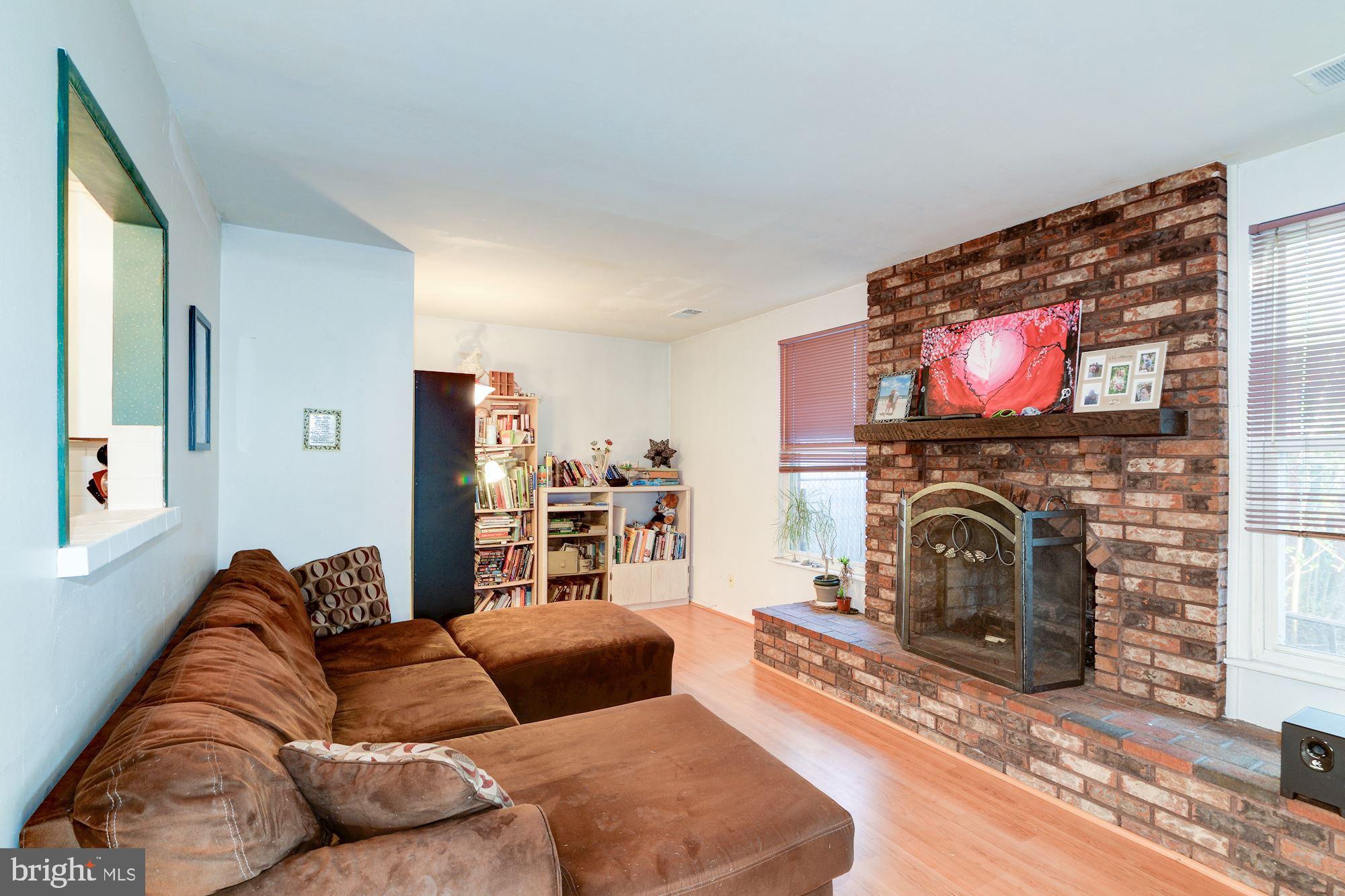 1604 Coventry Place Clementon, NJ 08021 - Photo 20 of 45 a living room with furniture a fireplace and a flat screen tv