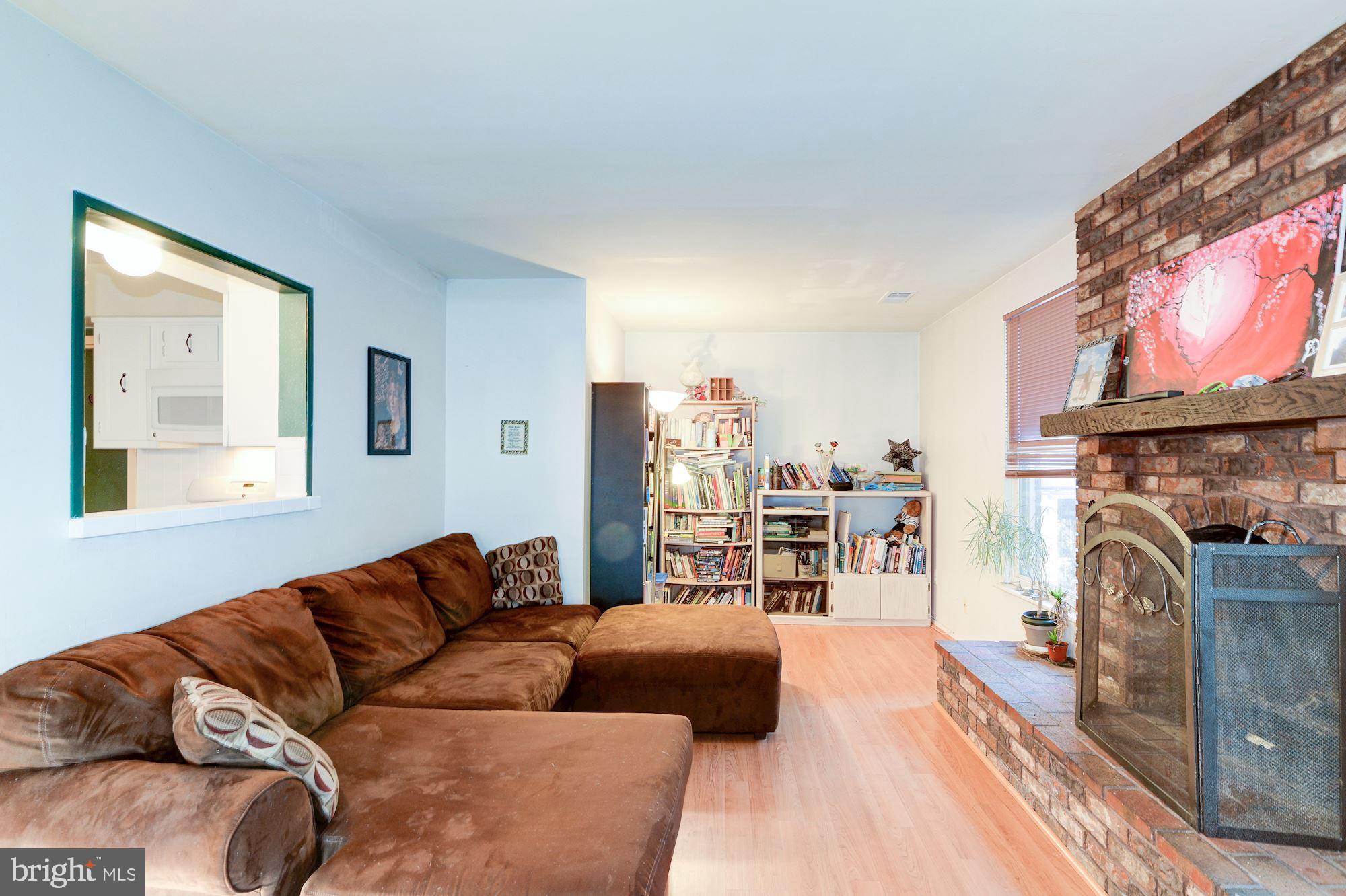 1604 Coventry Place Clementon, NJ 08021 - Photo 21 of 45 a living room with furniture a fireplace and a flat screen tv