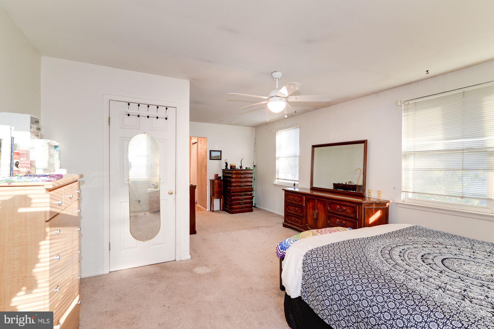 1604 Coventry Place Clementon, NJ 08021 - Photo 27 of 45 a bedroom with a bed flat screen tv and a large window