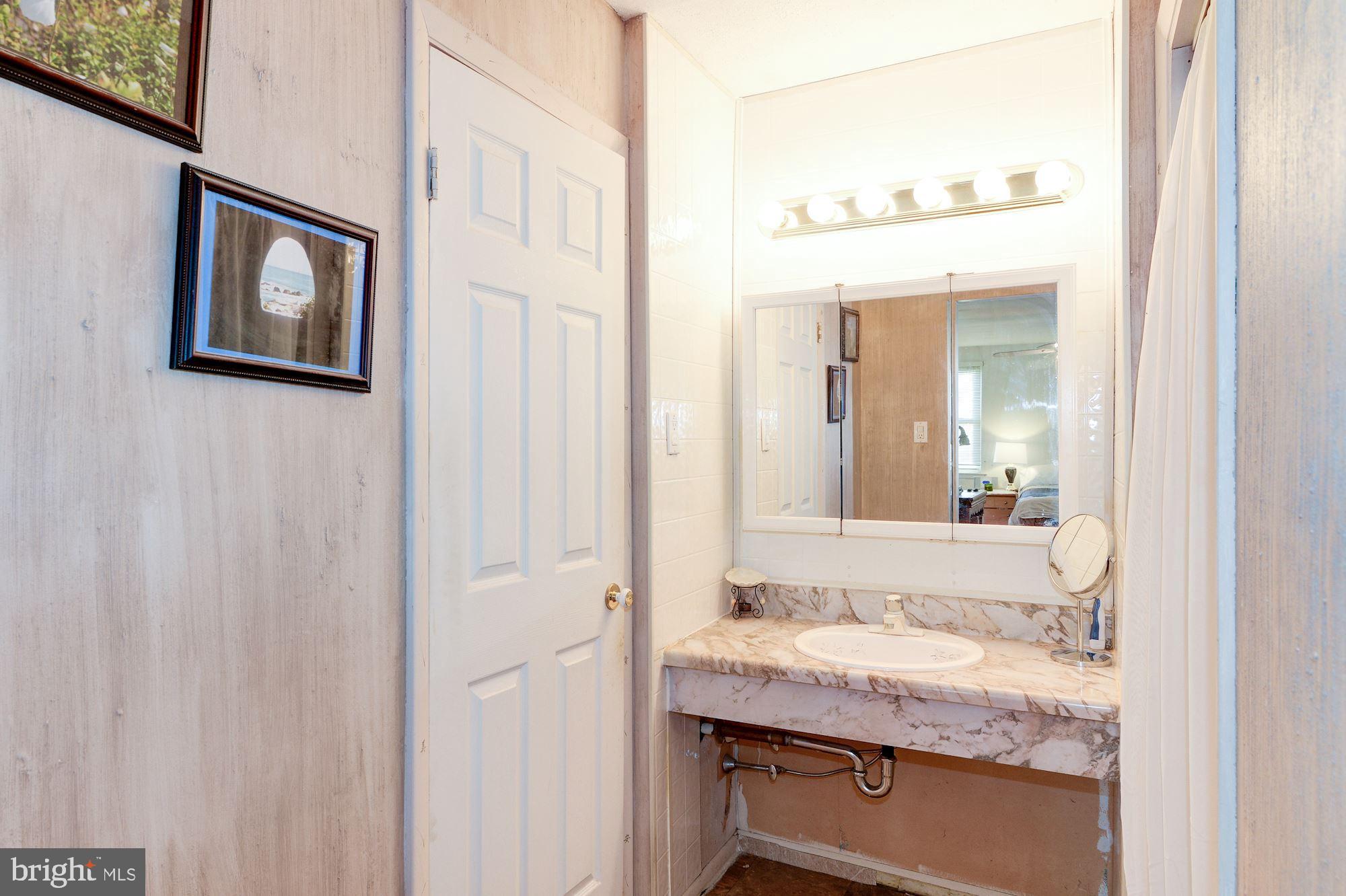 1604 Coventry Place Clementon, NJ 08021 - Photo 32 of 45 a bathroom with a granite countertop sink and a mirror