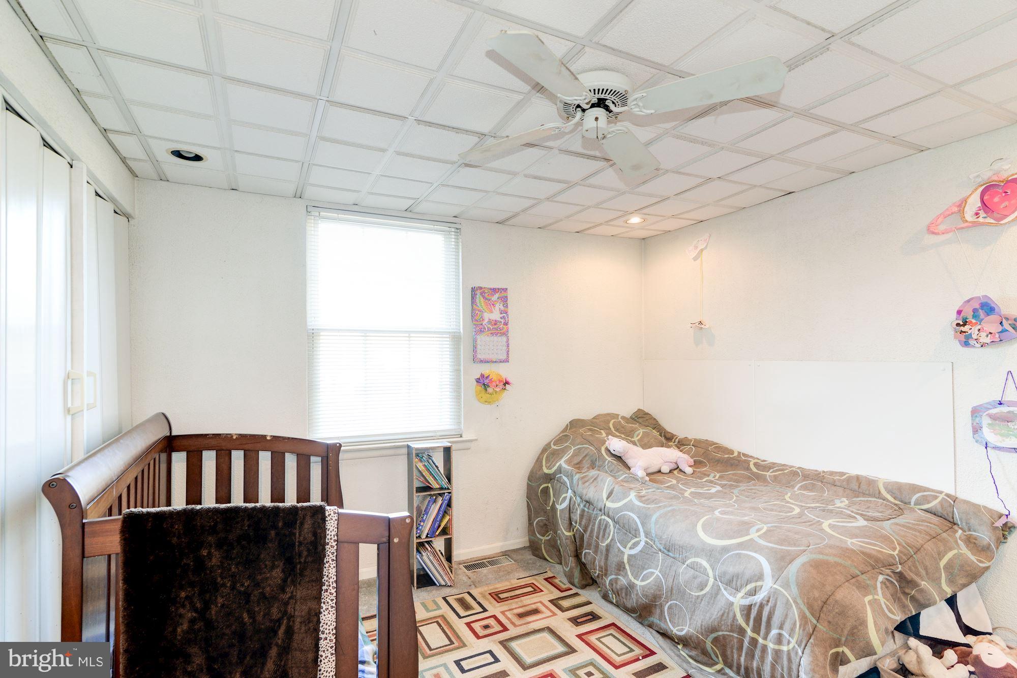 1604 Coventry Place Clementon, NJ 08021 - Photo 35 of 45 a bedroom with a bed and a chandelier