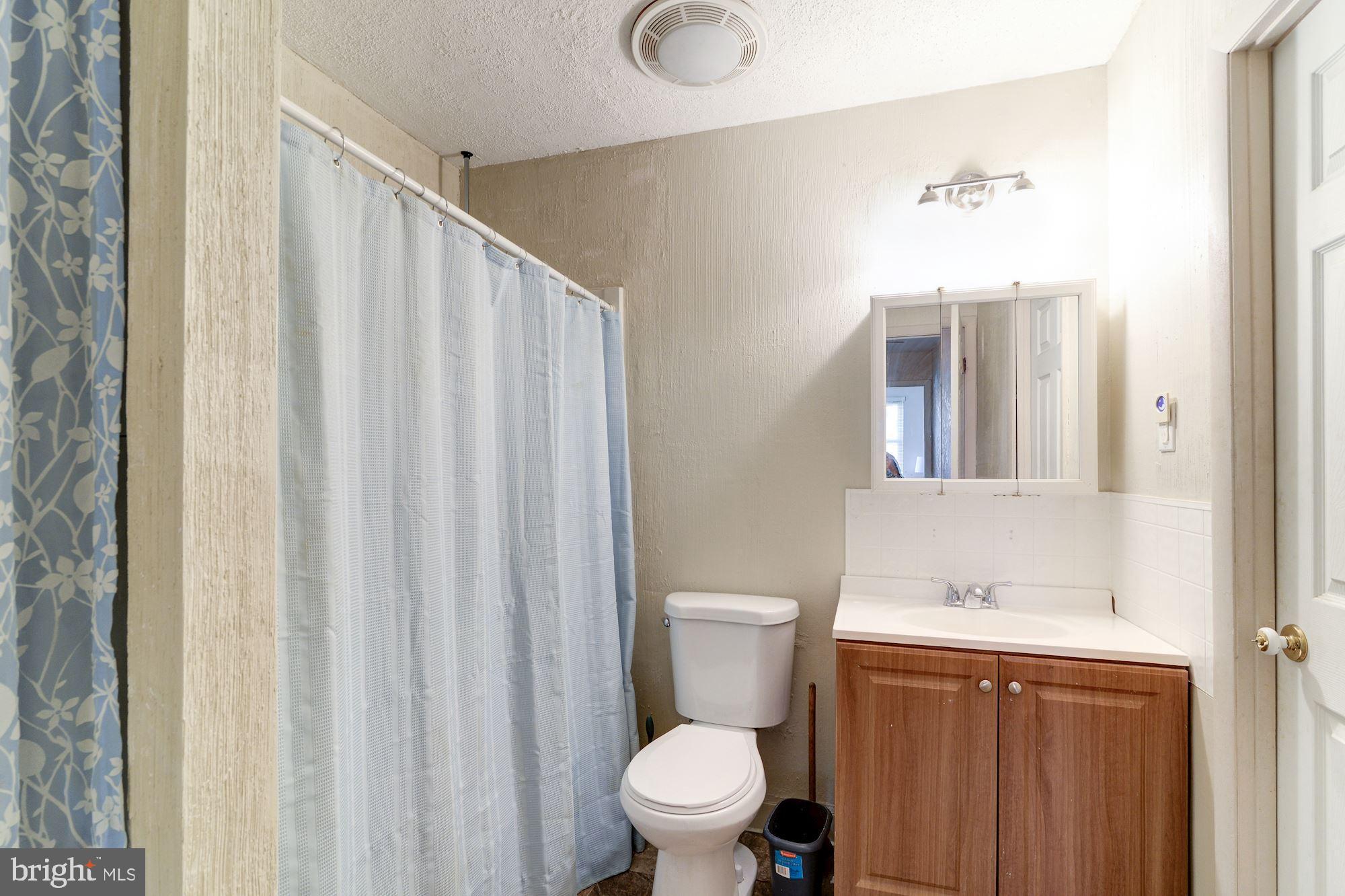 1604 Coventry Place Clementon, NJ 08021 - Photo 37 of 45 a bathroom with a granite countertop sink toilet and shower