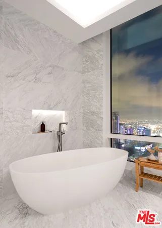 a bathroom with a tub and sink
