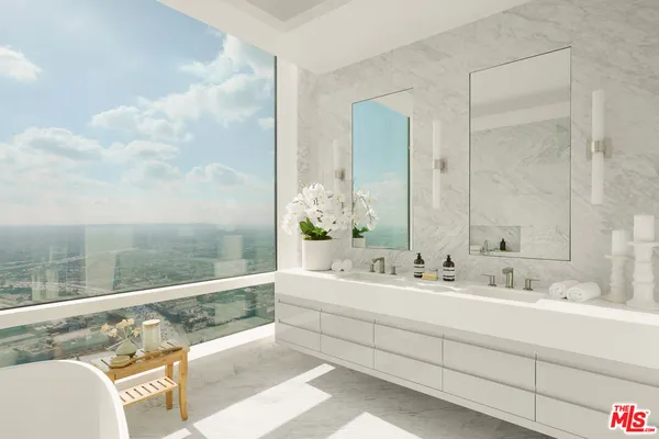 a bathroom with a double vanity sink and a mirror