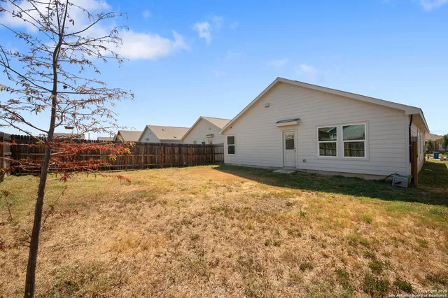 a house view with a backyard