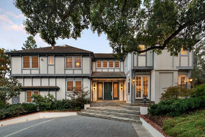 a front view of a house with garden