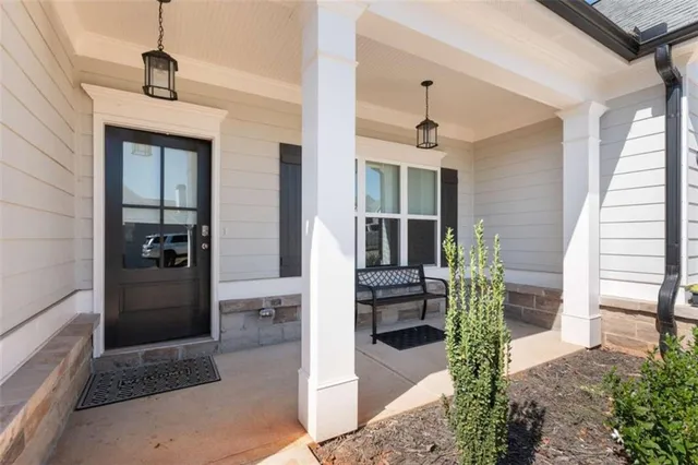 a front view of a house with a porch