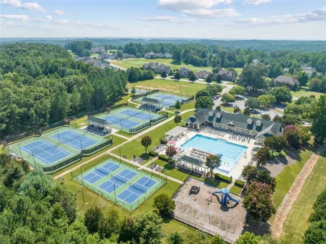 an aerial view of residential houses with outdoor space