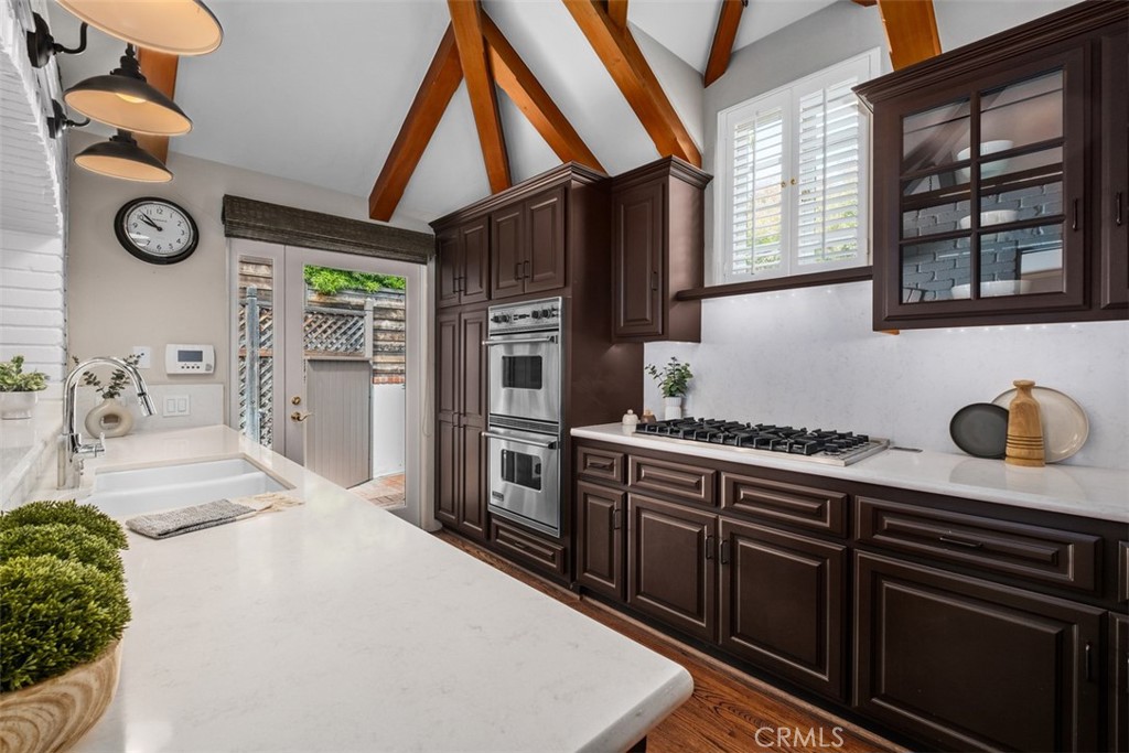 421 High Drive Laguna Beach, CA 92651 - Photo 12 of 42 a kitchen with granite countertop a stove and a sink