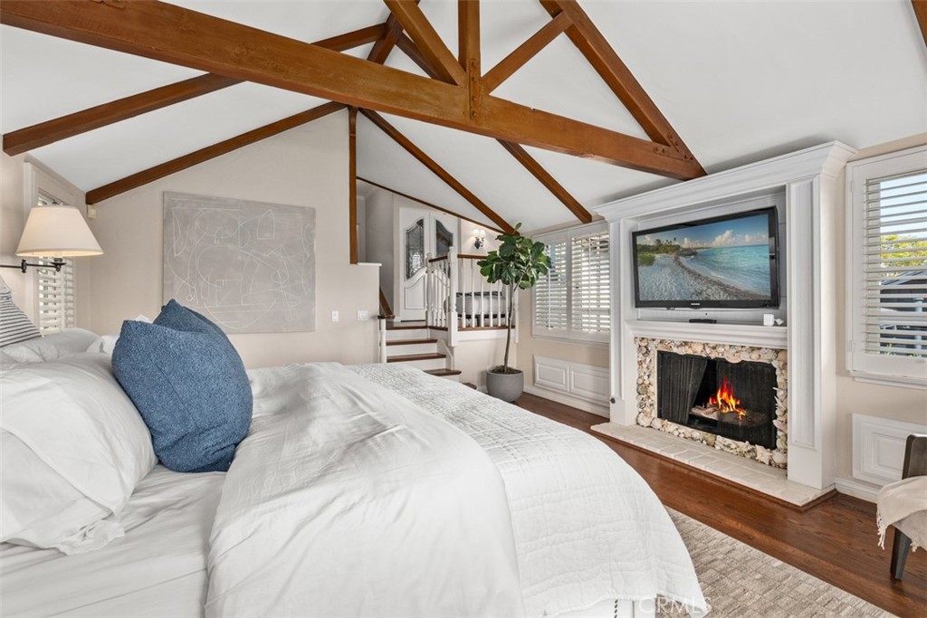 421 High Drive Laguna Beach, CA 92651 - Photo 21 of 42 a bedroom with a bed and a fireplace