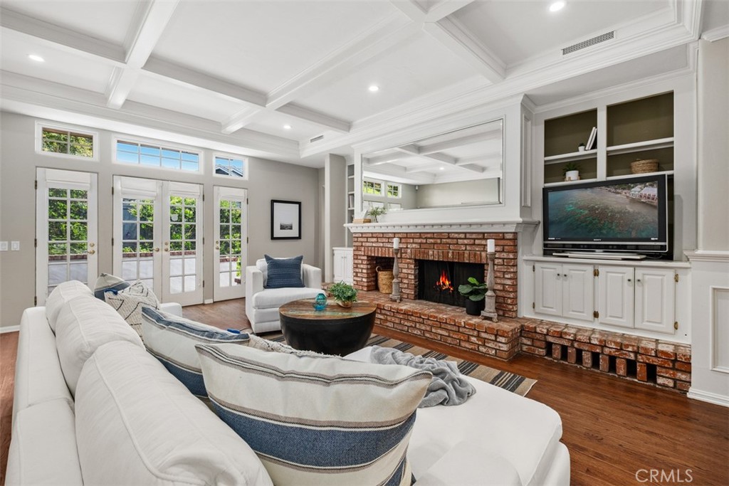 421 High Drive Laguna Beach, CA 92651 - Photo 28 of 42 a living room with furniture a flat screen tv and a fireplace