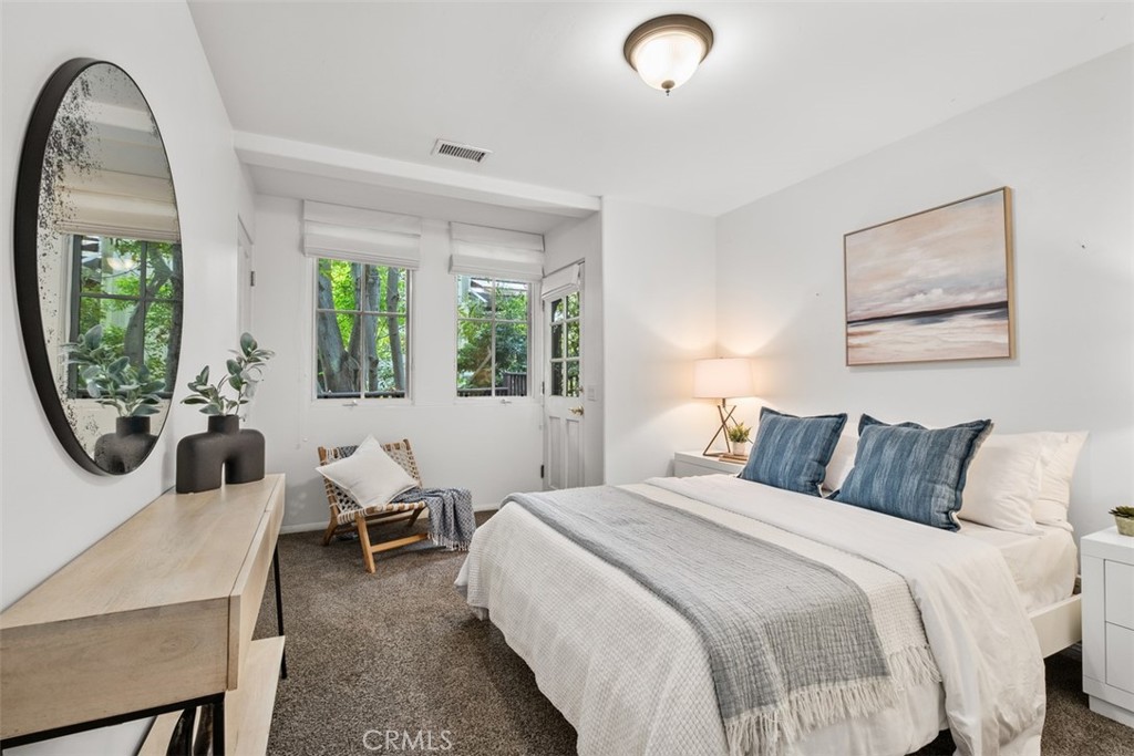 421 High Drive Laguna Beach, CA 92651 - Photo 32 of 42 a bedroom with furniture and a large window