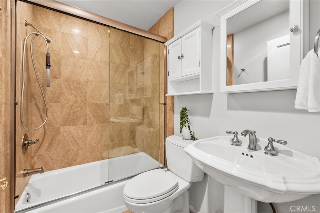 421 High Drive Laguna Beach, CA 92651 - Photo 33 of 42 a bathroom with a sink toilet and shower