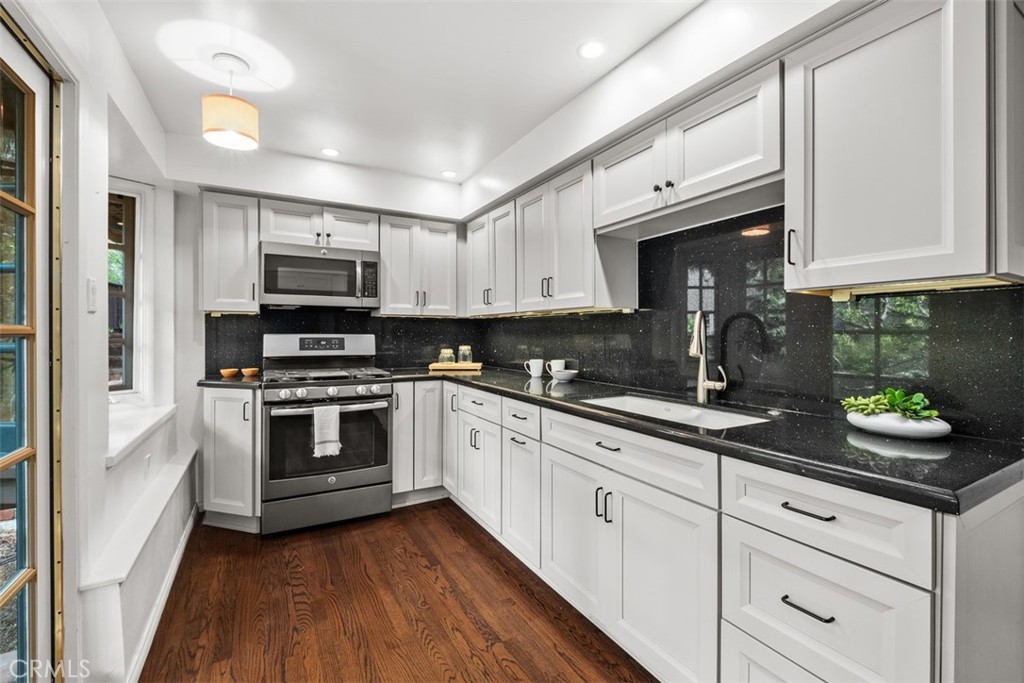 421 High Drive Laguna Beach, CA 92651 - Photo 34 of 42 a kitchen with appliances a sink and cabinets
