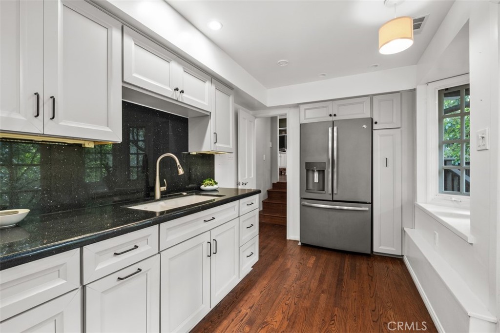 421 High Drive Laguna Beach, CA 92651 - Photo 35 of 42 a kitchen with granite countertop a sink stainless steel appliances and cabinets