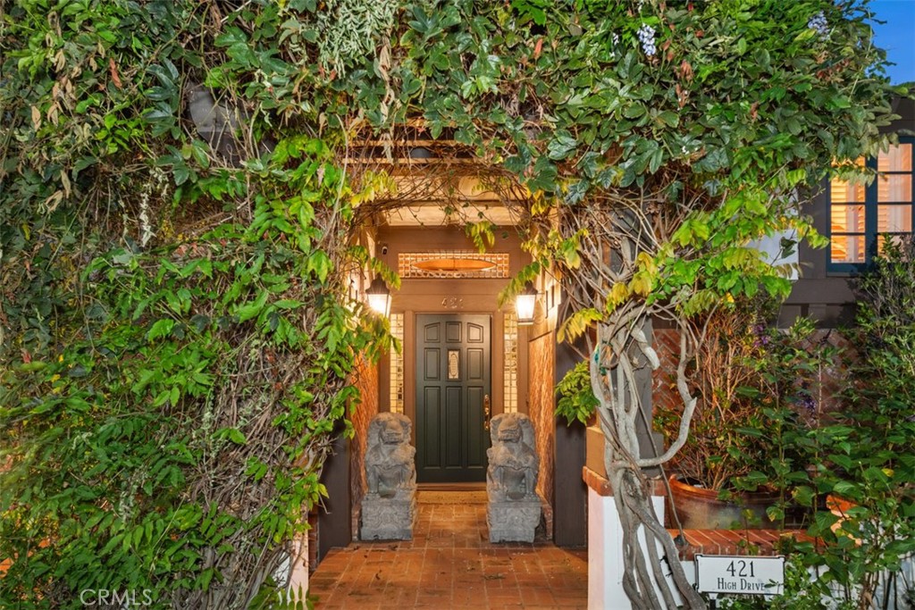 421 High Drive Laguna Beach, CA 92651 - Photo 4 of 42 a front view of a house with a tree