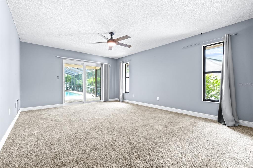 3404 Brian Road South Palm Harbor, FL 34685 - Photo 19 of 71 an empty room with windows and ceiling fan