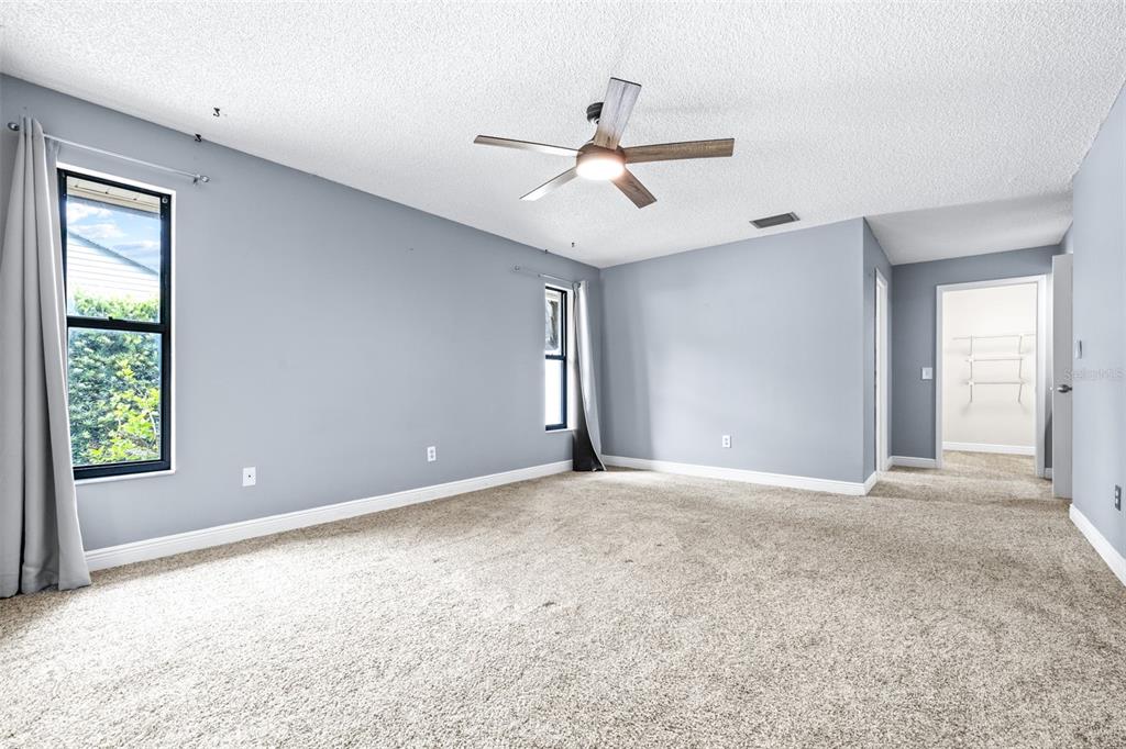 3404 Brian Road South Palm Harbor, FL 34685 - Photo 20 of 71 an empty room with windows and fan