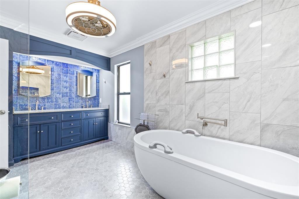 3404 Brian Road South Palm Harbor, FL 34685 - Photo 28 of 71 a bathroom with a tub sink and mirror