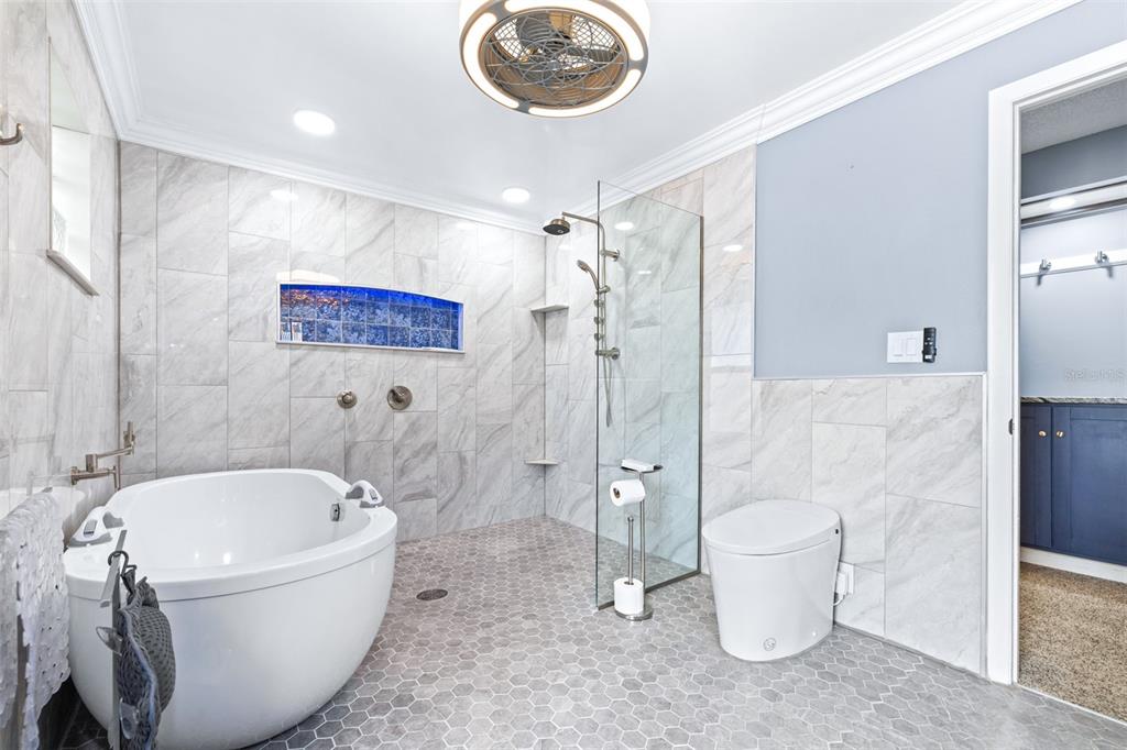 3404 Brian Road South Palm Harbor, FL 34685 - Photo 30 of 71 a bathroom with a tub toilet and a sink