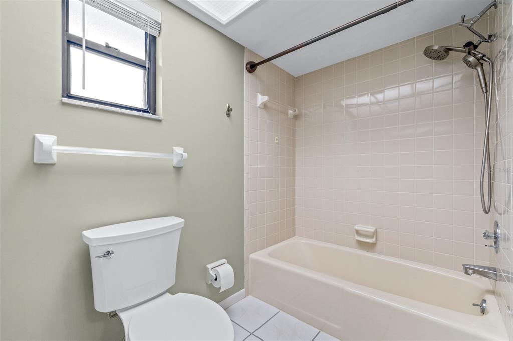 3404 Brian Road South Palm Harbor, FL 34685 - Photo 37 of 71 a white toilet sitting next to a bath tub shower