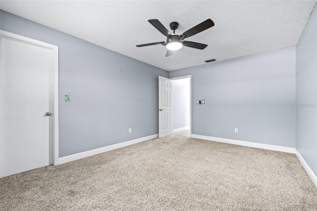3404 Brian Road South Palm Harbor, FL 34685 - Photo 41 of 71 an empty room with ceiling fan and window