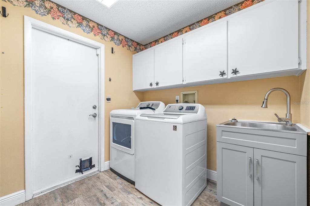 3404 Brian Road South Palm Harbor, FL 34685 - Photo 44 of 71 a utility room with sink dryer and washer
